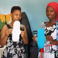 Our students are showing their first sewn washable sanitary pads.
